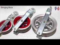 Le câble de câblage de mise à la terre est tiré par une poulie et le conducteur est branché par des blocs